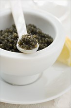 Closeup of a bowl of caviar.