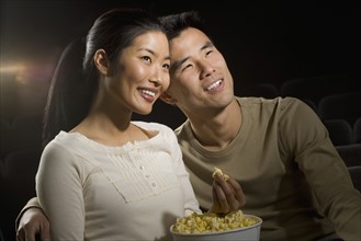 Couple watching a movie.