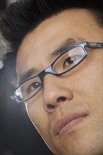 Headshot of man wearing glasses.