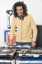 DJ with his music mixing equipment.