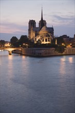 Notre-Dame de Paris
Scenic view of cathedral next to water at night.
