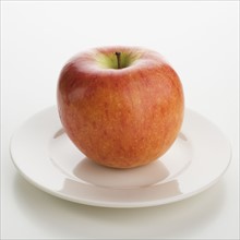 Close up of apple on plate.