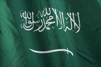 Close up of Saudi Arabian flag.