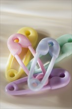 Close up of plastic diaper pins.