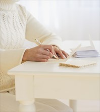 Woman writing cards.