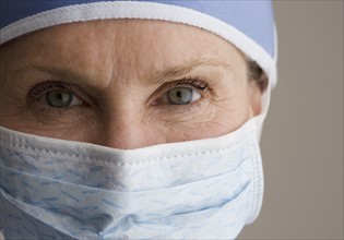 Close up of female doctor wearing surgical mask.