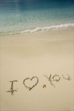 I Love You written in sand.