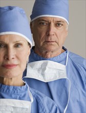 Portrait of senior male and female surgeons.