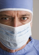 Close up of male doctor wearing surgical mask.