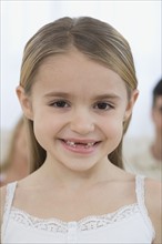 Portrait of girl with missing front teeth.