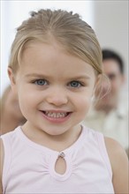 Close up of girl smiling.