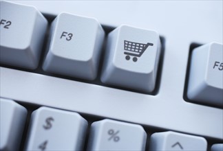 Close up of shopping cart button on keyboard.