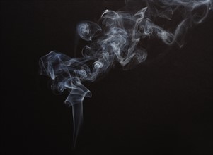 Smoke with black background.