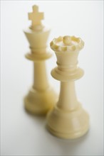 Close up of white chess pieces.