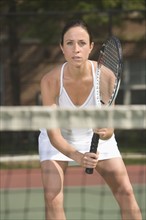 Close up of woman playing tennis.