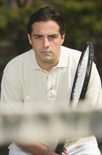 Close up of man playing tennis.