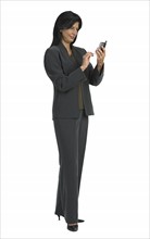 Businesswoman looking at cell phone.