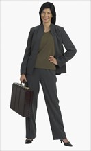 Studio shot of businesswoman holding briefcase.