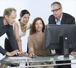 Group of businesspeople with computer.