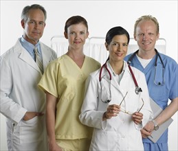 Group of male and female doctors smiling.