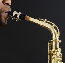 Close up of man playing saxophone.