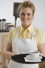 Portrait of waitress in cafe.