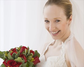Close up of bride holding bouquet.
