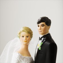 Close up of bride and groom figurines.