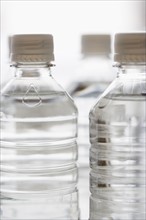 Close up of bottled water.