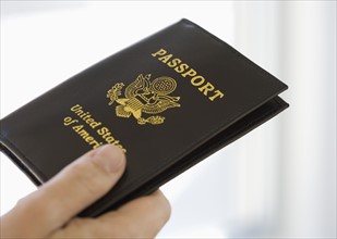 Man holding passport.