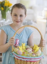 Girl holding Easter basket.