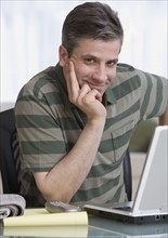 Man sitting at laptop.