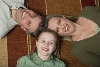 High angle view of family on floor.