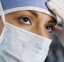 Indian female doctor wearing surgical mask.