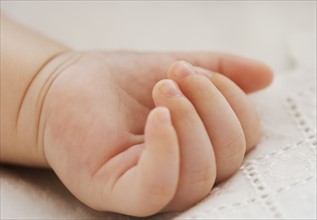 Close up of baby’s hand.