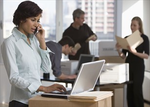 Businesspeople working in new office.