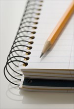 Close up of notepad and pencil.