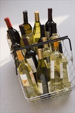 Shopping basket filled with wine.