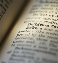 Close up of Debt in the dictionary.