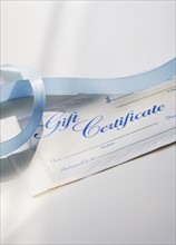 Close up of gift certificate and ribbon.