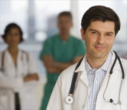 Male doctor wearing stethoscope.