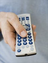 Man holding remote control.