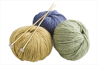 Bundles of yarn and knitting needles.