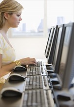 Woman typing on computer.