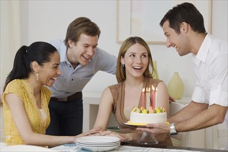 Woman celebrating birthday with friends.