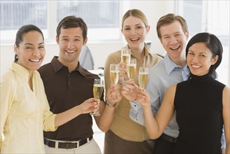 Businesspeople toasting with champagne.