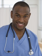 Portrait of male doctor with stethoscope around neck.