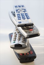 Stack of remote controls.