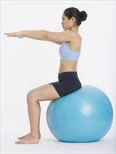 Woman sitting on exercise ball.