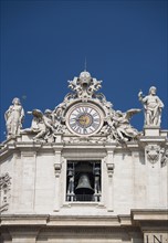 Clock on St. Peter’s Basilica, Italy.